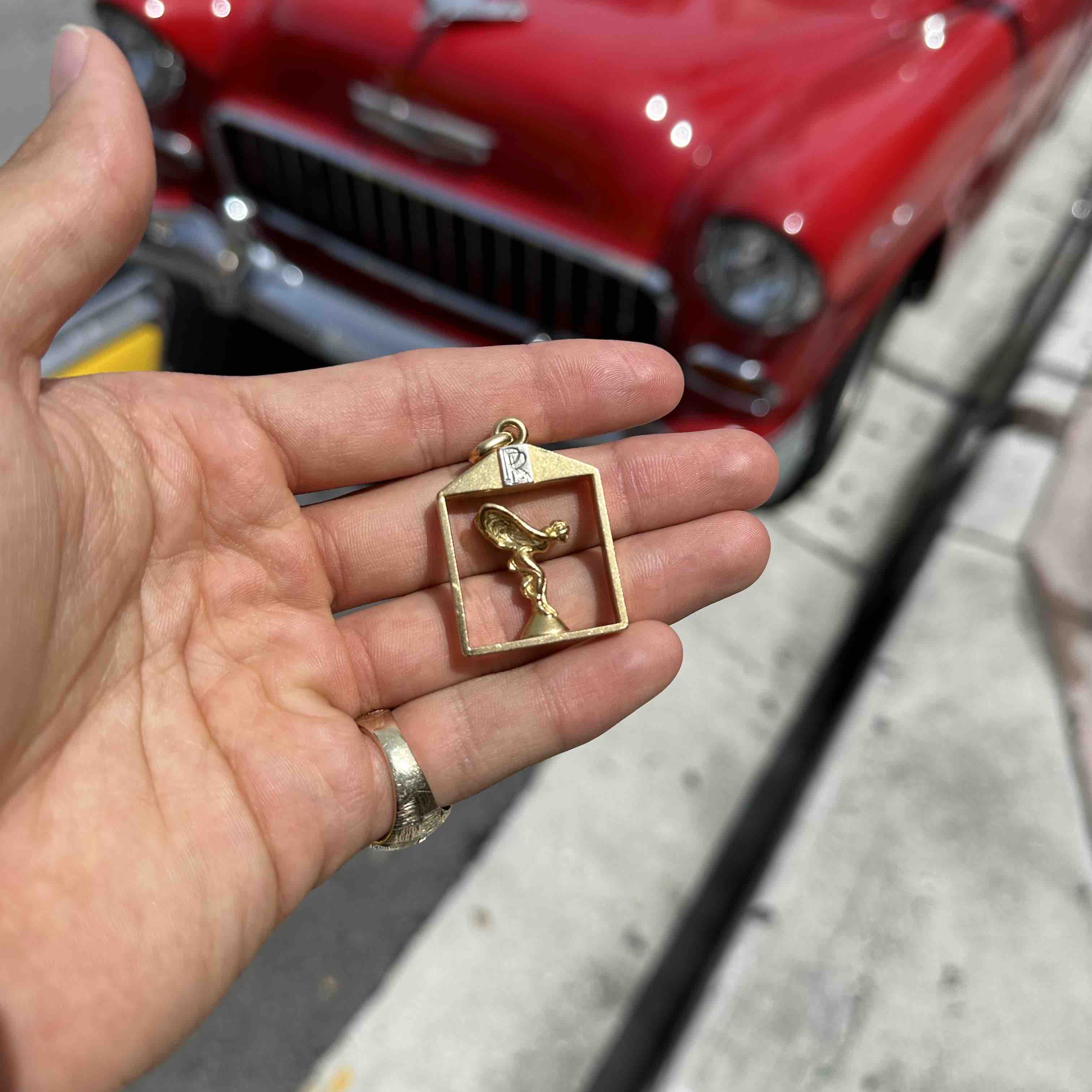 Rolls royce deals gold pendant