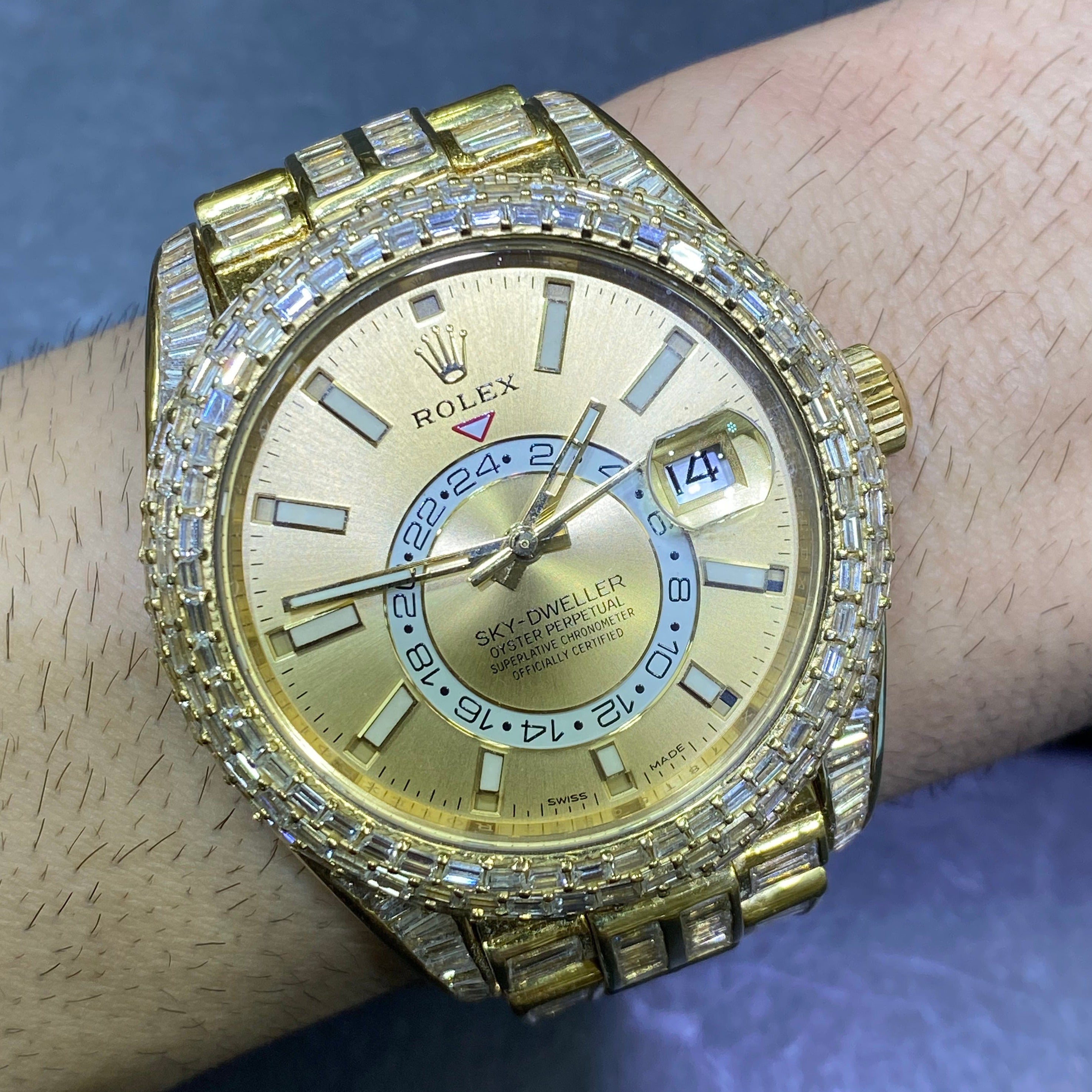 42mm rolex "iced bust down" sky dweller watch. 60 cts of VVS1 natural baguette diamonds and 18k solid gold