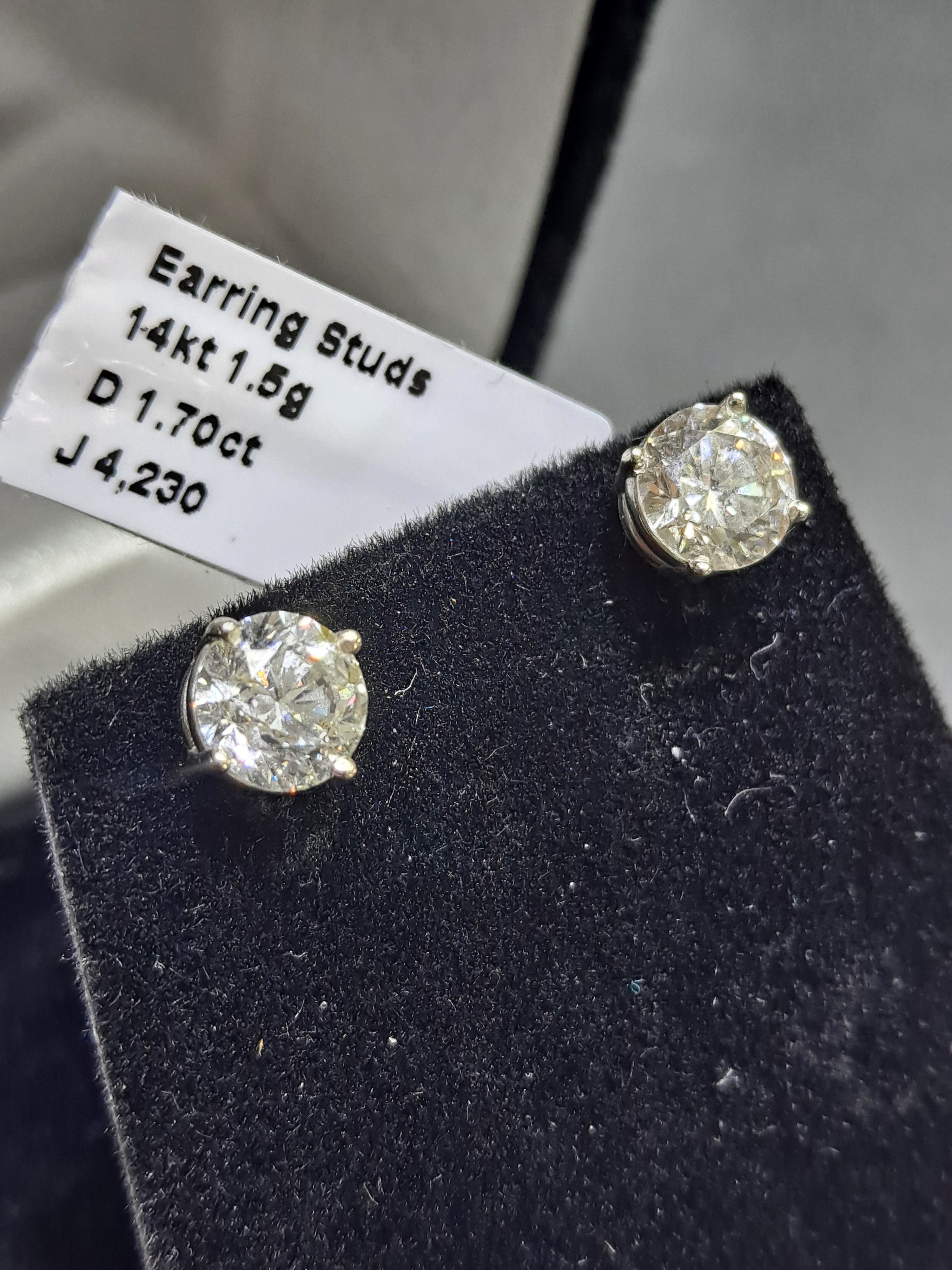diamond stud earrings .85 cts each 1.70 cts t.w.
