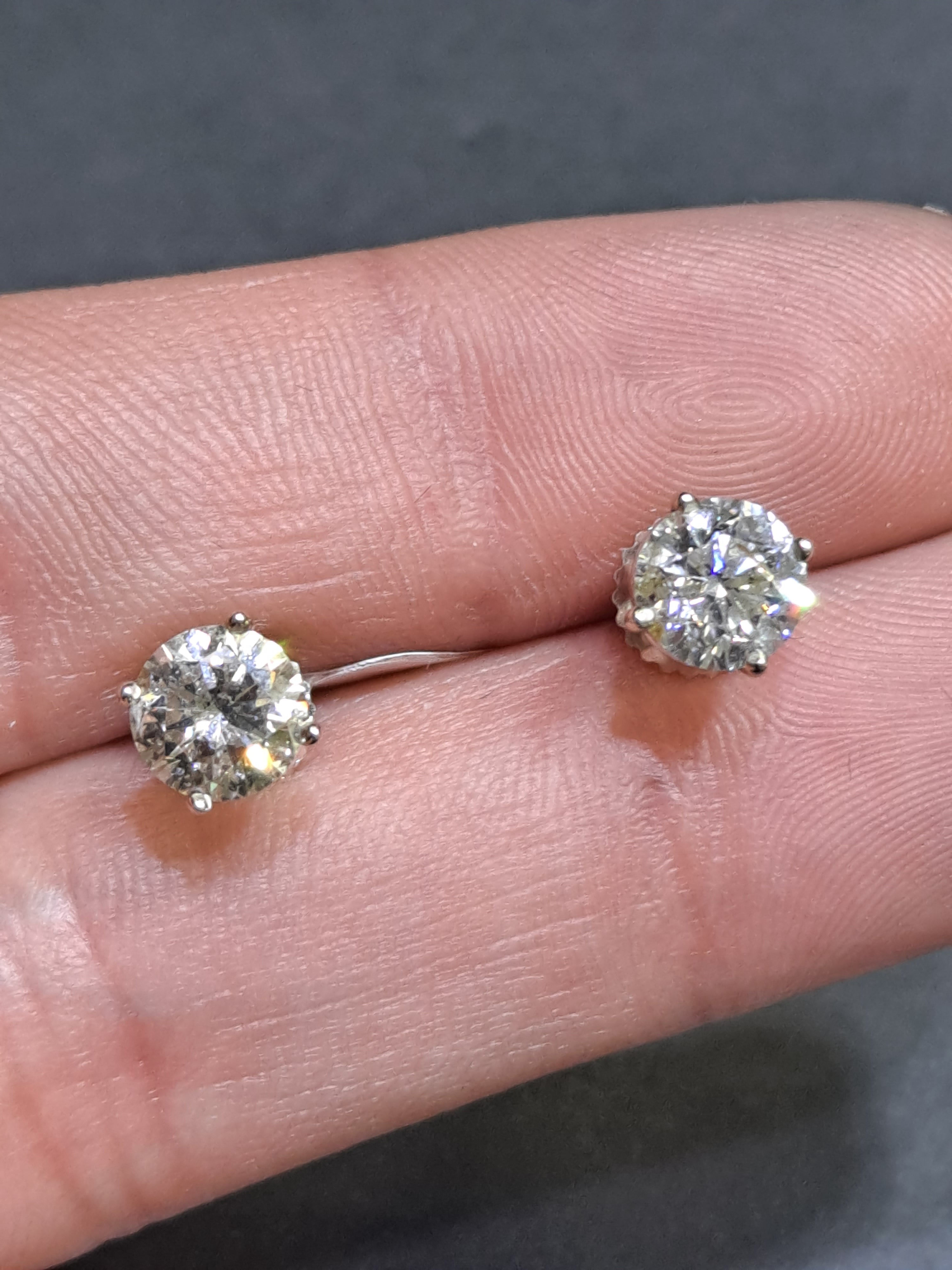 diamond stud earrings .85 cts each 1.70 cts t.w.