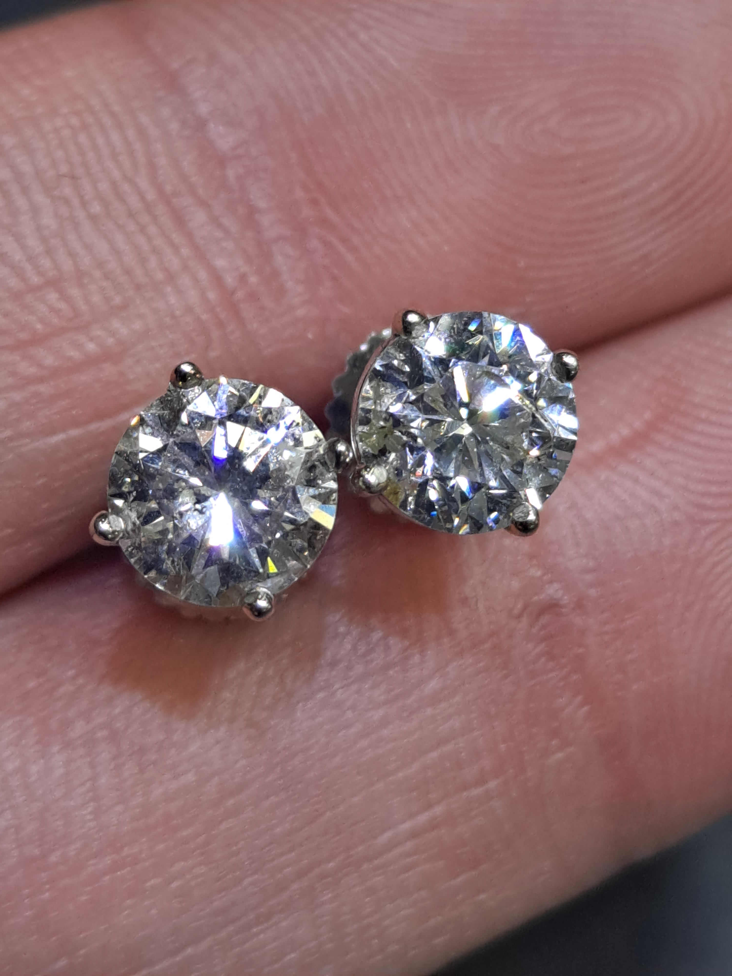 diamond stud earrings .85 cts each 1.70 cts t.w.