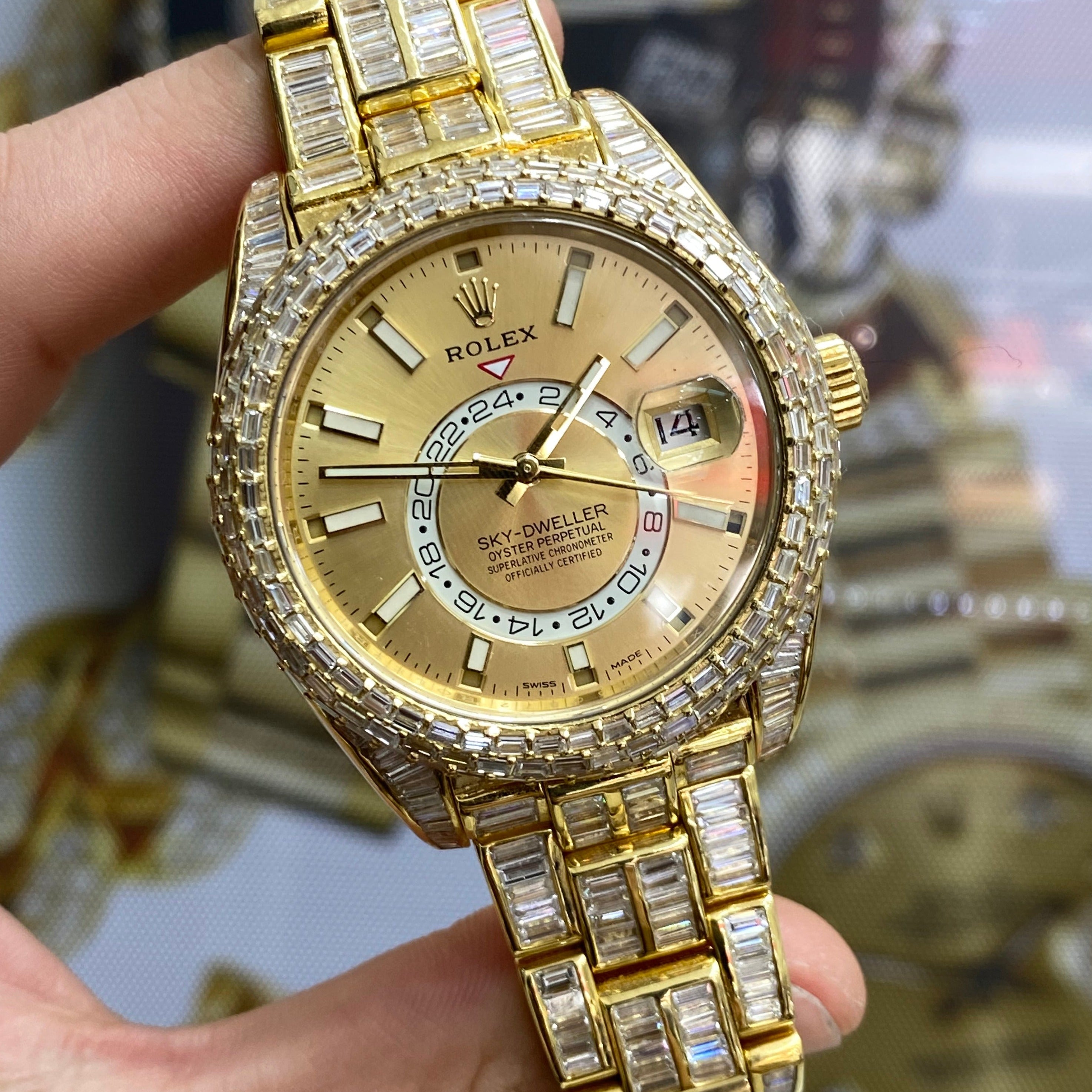 42mm rolex "iced bust down" sky dweller watch. 60 cts of VVS1 natural baguette diamonds and 18k solid gold