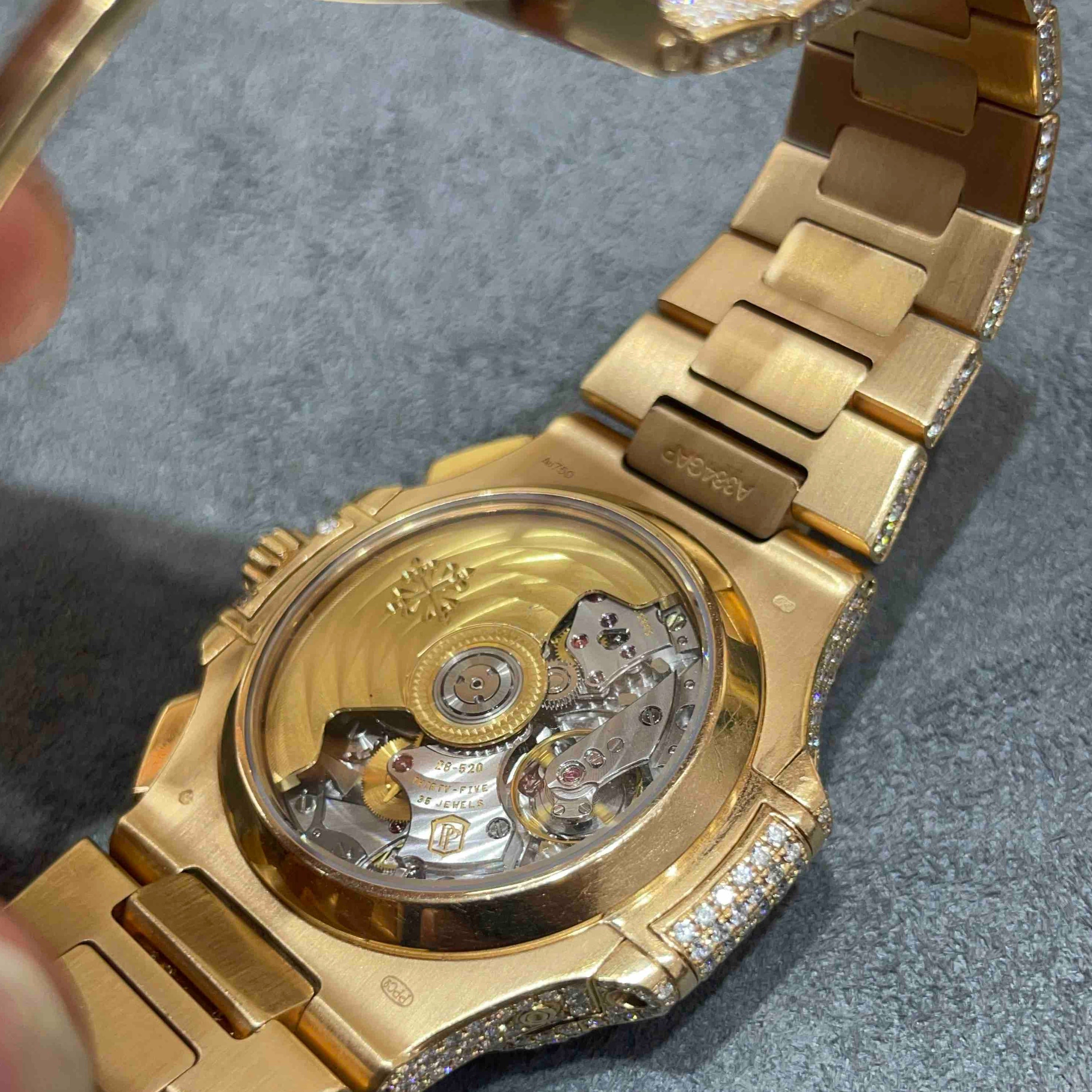 Patek philippe nautilus rose gold best sale iced out