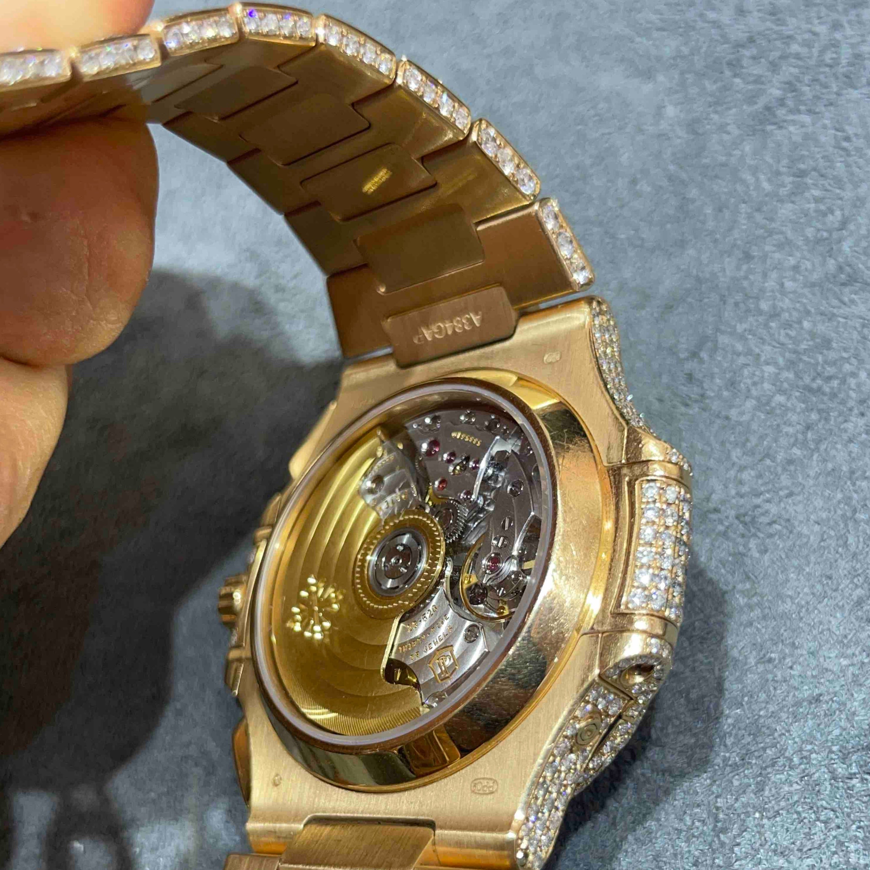 Patek philippe nautilus discount rose gold iced out