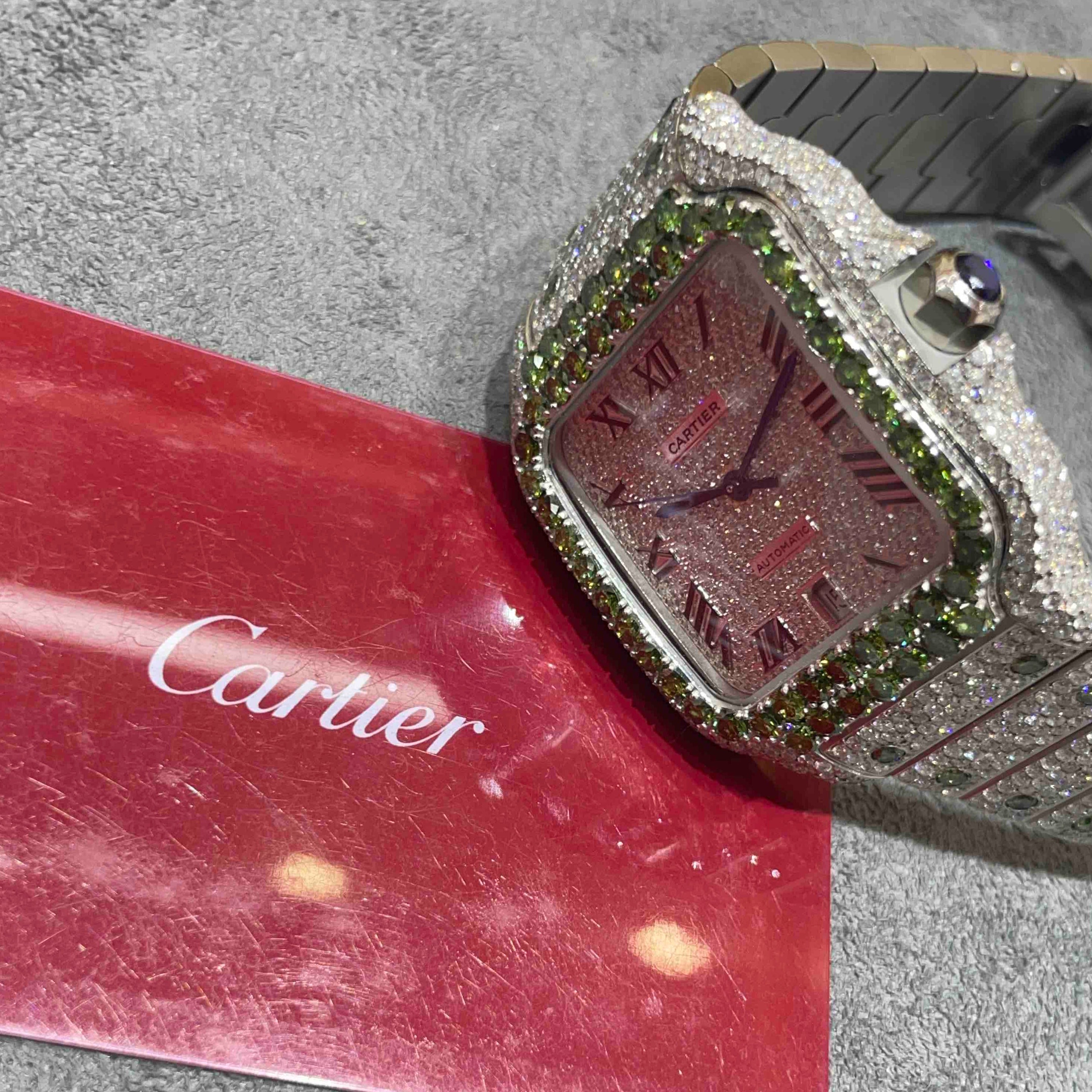 EMERALD ICED OUT CARTIER WATCH