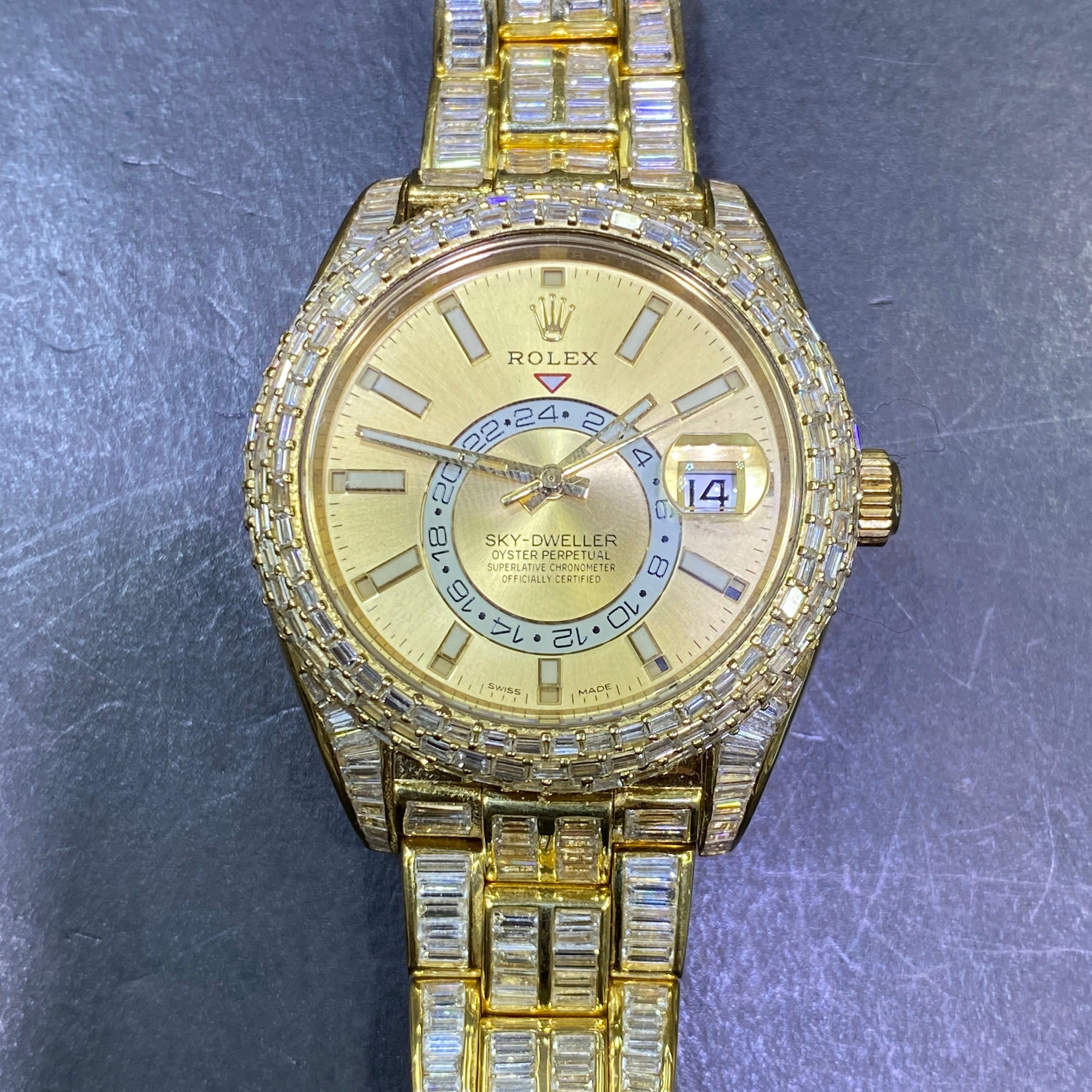 42mm rolex "iced bust down" sky dweller watch. 60 cts of VVS1 natural baguette diamonds and 18k solid gold