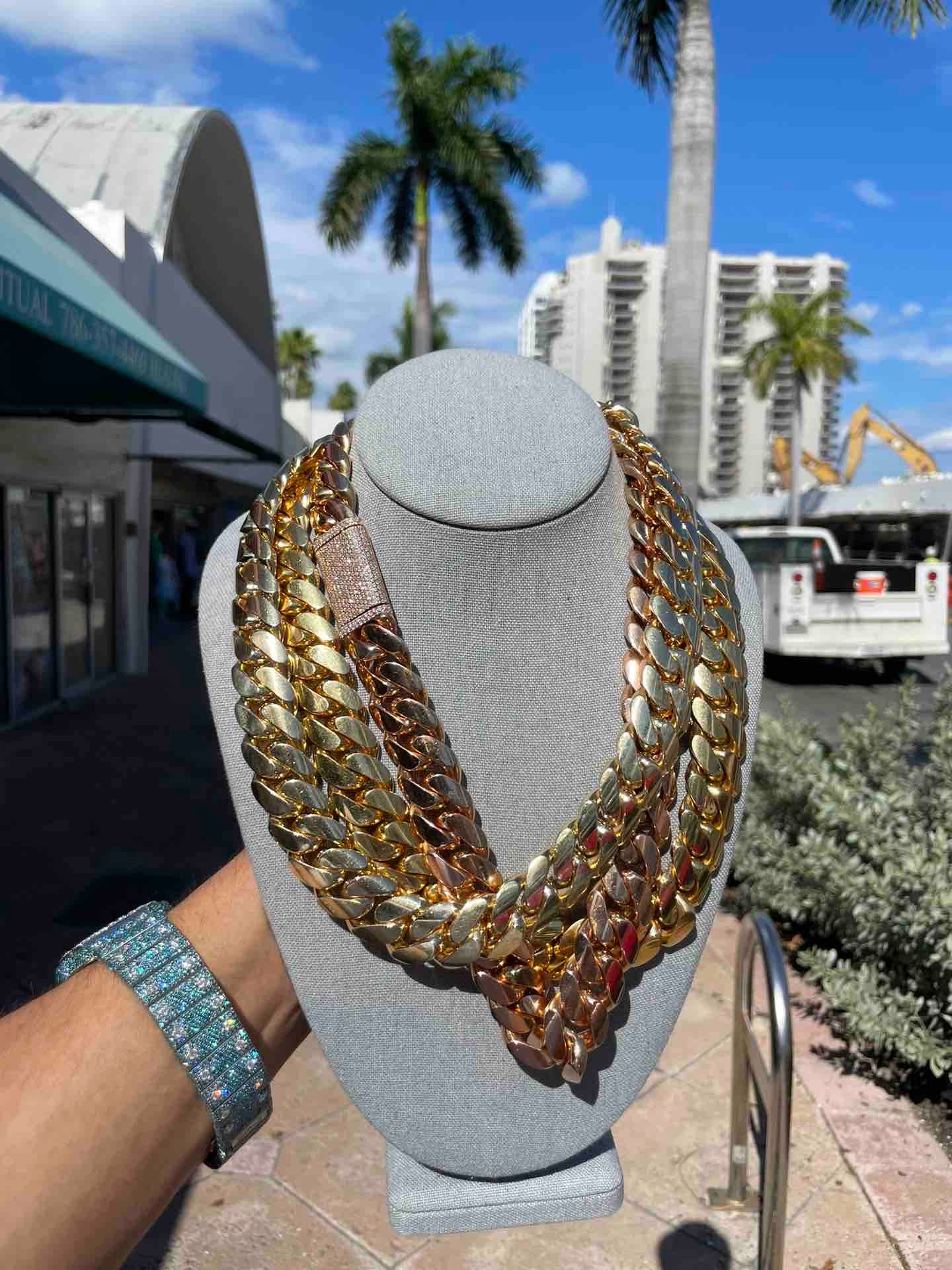 heavy cuban link chains rose gold and yellow gold on miami beach at renee de paris jewelry