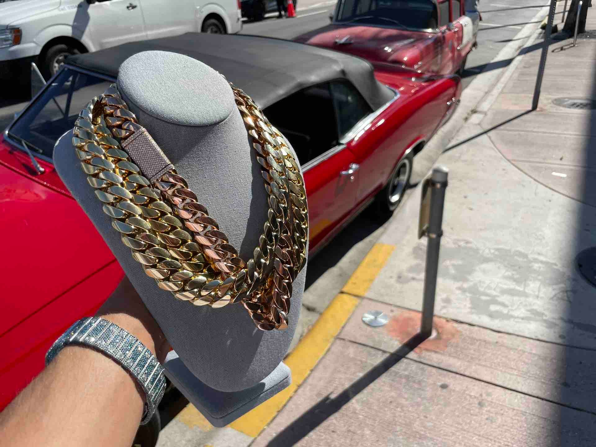 heavy cuban link at renee de paris jewelry on miami beach in front of an old school